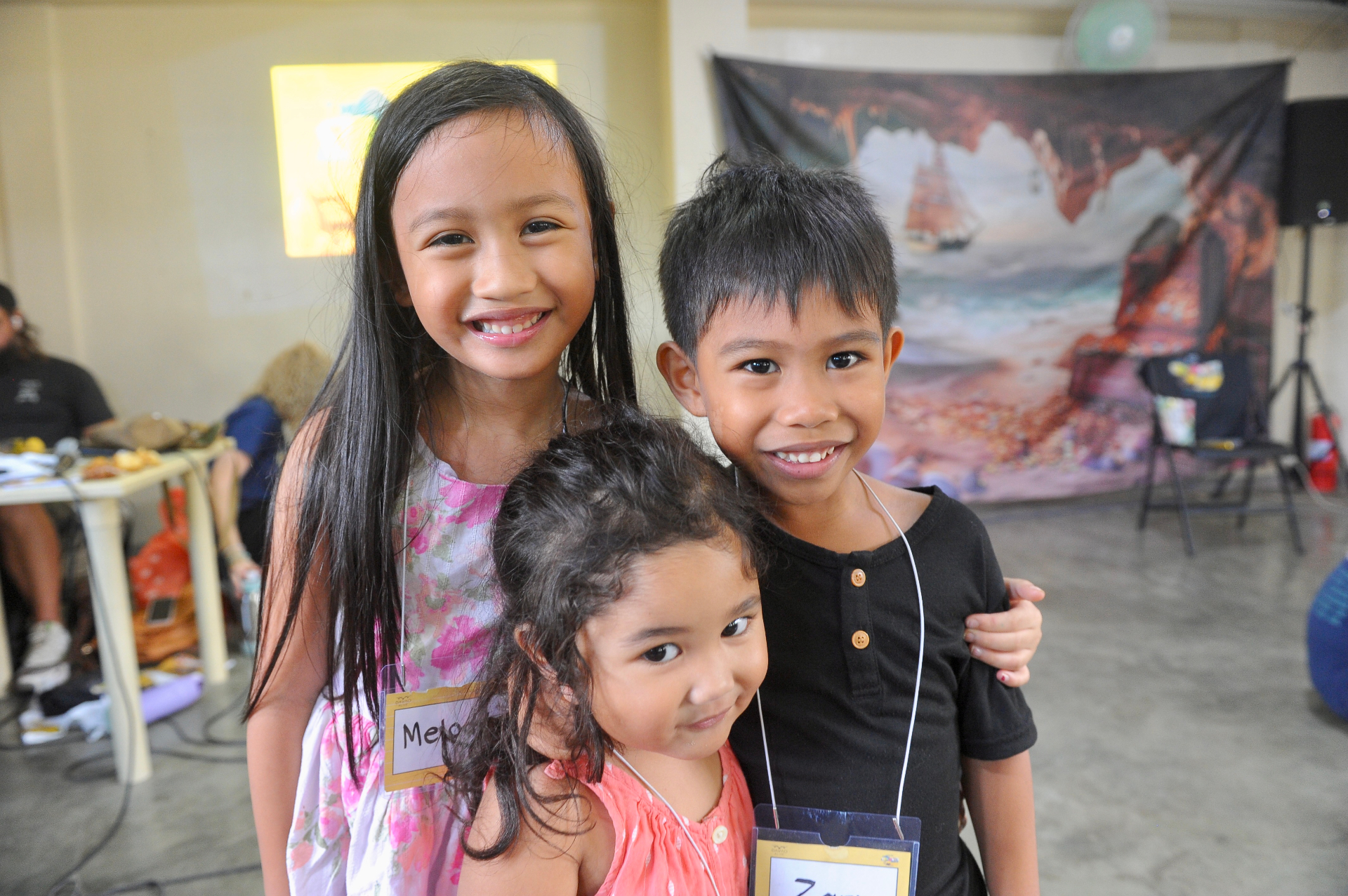 Three children at the summer kids club at Oasis Family Center